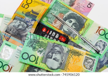 calculator with pen on australia banknotes for financial concept