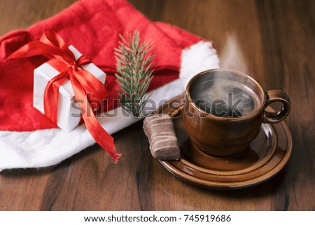 Christmas gifts on wood background and coffee