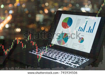 investment portfolio on screen laptop computer with index stock market and chart with uptrend stock market graph. Royalty-Free Stock Photo #745934506