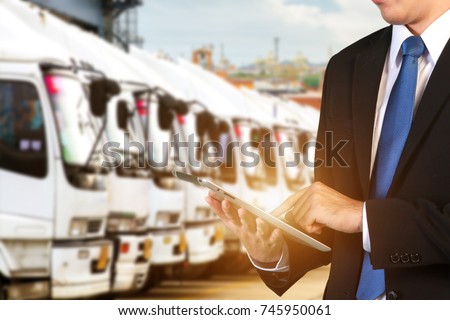 Logistic Concept, Manager working with tablet and smartphone for Import Export background Royalty-Free Stock Photo #745950061