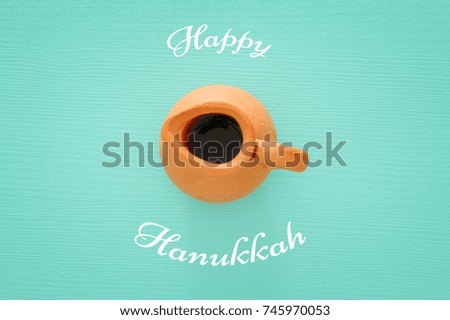 jewish holiday Hanukkah image background with traditional oil ceramic jug.