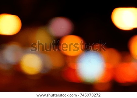 Bokeh from street lights and car at night.