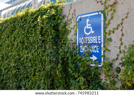 Wall with handicap accessible sign