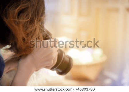 woman hand is shooting photography, dslr camera with a blurred for background