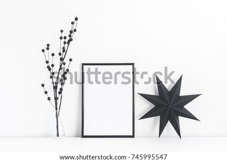 Christmas composition. Black frame and christmas decor on white background. Front view, mock up, copy space
