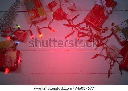 the christmas gift boxes and lighting on wooden table