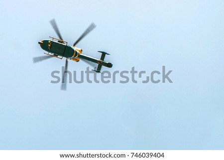 Flying Helicopter in clear sky background , Helicopter in the sky use for background. Summer Holiday and Travel concept.