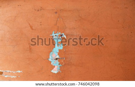 Red peeling paint. Old concrete background. Faded walls. Abstract textures.