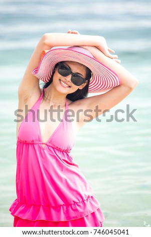 Portrait of Woman posing at the Beach with Attractive Smiling, People with Summer Concept. Vintage Tone.