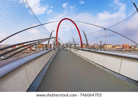 Turin, Lingotto, suspended red catwalk with red bow. Royalty-Free Stock Photo #746064703