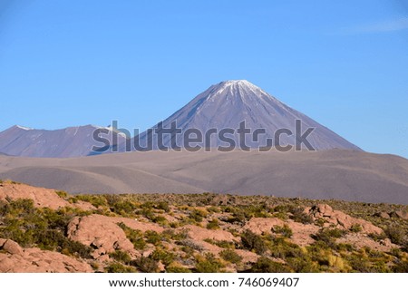 Snow capped volcano in Chile Royalty-Free Stock Photo #746069407