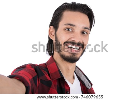 Cheerful good looking man taking selfie. Isolated on white background.