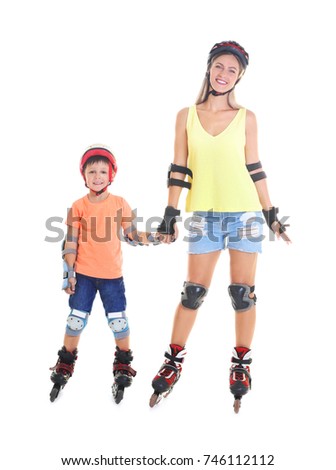 Mother and son on roller skates against white background