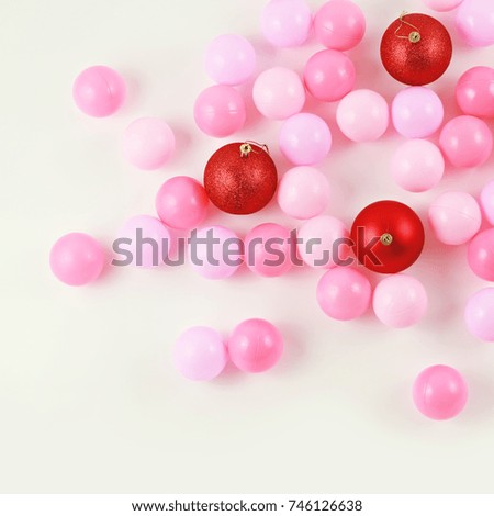 Red christmas balls with pink color balls on white background