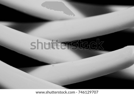 Abstract geometric black and white background from the teeth of plastic forks