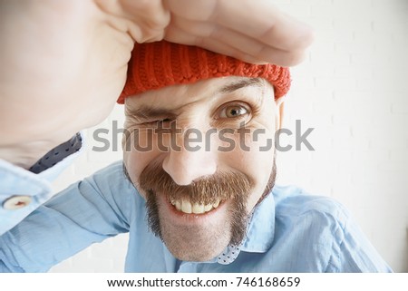 bearded man looks into the frame
