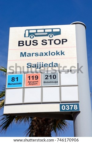 Bus stop sign showing destinations and bus numbers, Marsaxlokk, Malta, Europe.