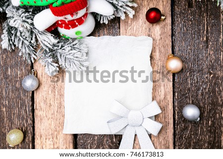 Christmas Greeting card with red ball and christmas tree on wooden background. Top view