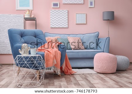 Modern living room interior with blue armchair