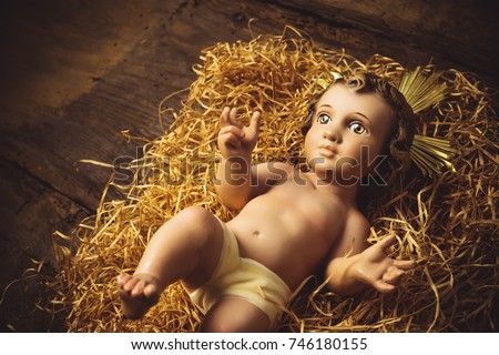 Christmas greeting card, Baby Jesus vintage figurine in his crib. Royalty-Free Stock Photo #746180155