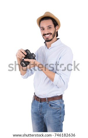A young male photographer likes his job. Isolated on white background.