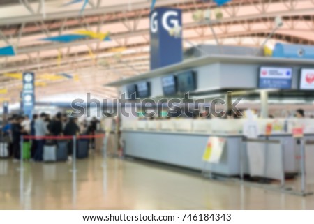 Blurred Airport check-in counter for air travelers.