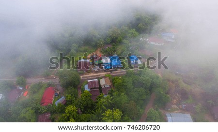 Clouds on the sky and roofs on the house
