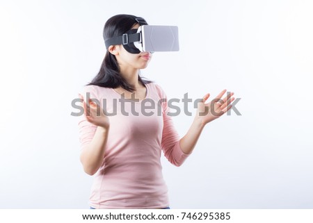 Woman in VR headset looking up at the objects