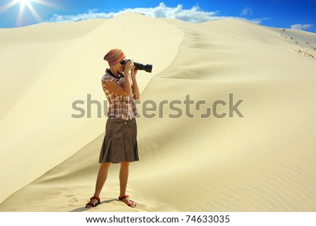 Woman on the background of the dune.
