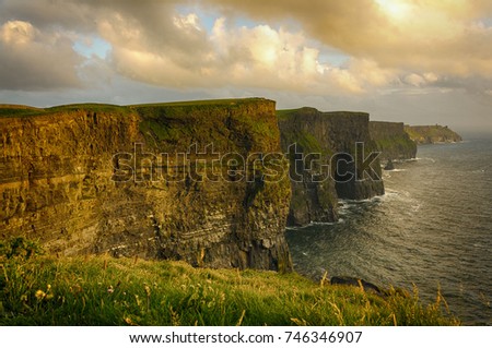 Cliffs of moher , county clare, ireland. Ireland's number 1 scenic landscape and seascape tourism attraction along the wild atantic way. beautiful rural irish countryside sunset picture.