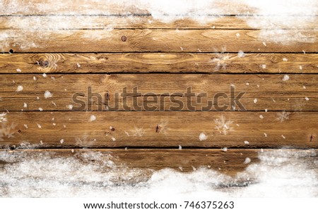 winter wooden background with snowflakes  Royalty-Free Stock Photo #746375263
