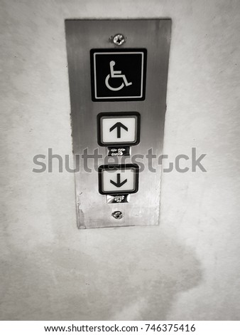 Handicap sign on elevator button