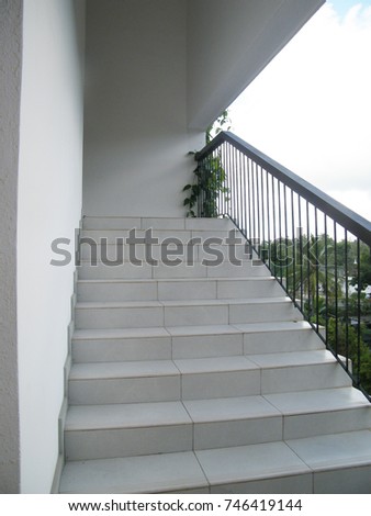 Luxury villa veranda. External staircase, steps in a hotel with timber handrail.