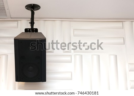 Black speaker hang on ceiling