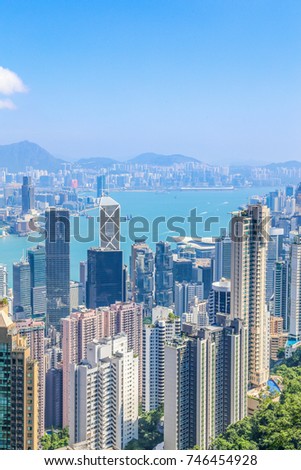 Cityscape in a bright blue day of the business building at Victoria harbour, Hong Kong
