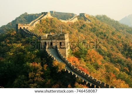 Wall in Autumn
China, Beijing: Great Wall in autumn. The section of the wall is Mutianyu. The wall passes along the crests of the hills, covered with wood. Royalty-Free Stock Photo #746458087