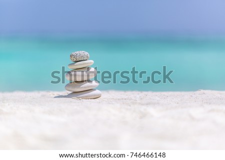 Sea stones balance and wellness retro spa concept, inspiration, zen like and well being tranquil composition. Close-up of zen stones at the beach