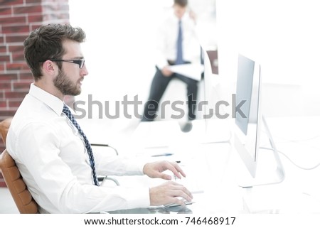 businessman working on computer with financial charts