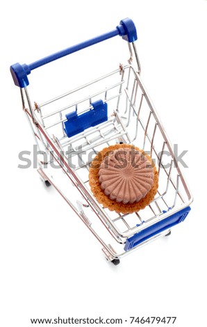Chocolate cookie in a shopping cart  on white background 