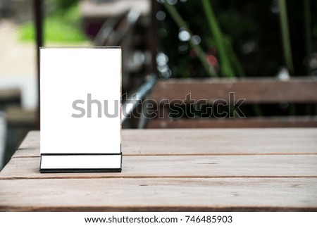 mock up menu object in cafe and restaurant,blank screen for booklet with white sheets of paper on wooden table on cafeteria,copy space for text or graphics object