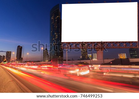 Blank billboard on light trails, street and urban in the night or twilight - can advertisement for display or montage product or business.