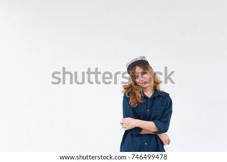 Portrait of hipster girl on white wall,lifestyle of modern teen,Cool hipster woman wear hat,Thailand people pose for take a picture
