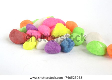 Color stones on white - abstract background.
