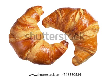 Two fresh croissants isolated on a white background Royalty-Free Stock Photo #746560534