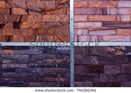Stone background with natural abstract pattern of natural stone texture. background of exhibition set of natural stone on trade stand. Natural tiles as decorative background for decoration of facade