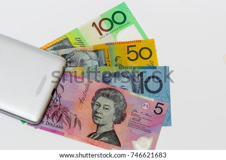 ten australia dollar inside glass jar isolated on white.financial concept