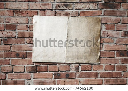 old paper on brickwall