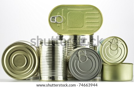 lots of cans against white background