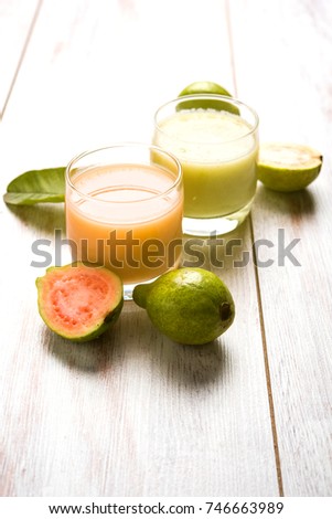 Guava Smoothie/Juice in glass, Red and Green in colour.Indian names of this fruit are Amrud, Jaam or peru. selective focus