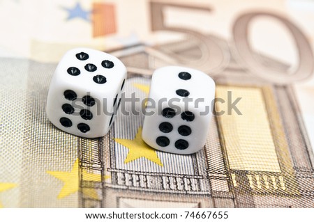 Dice on fifty euro banknote